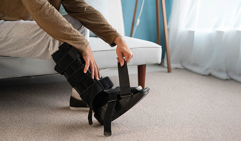 Person recovering post ankle surgery